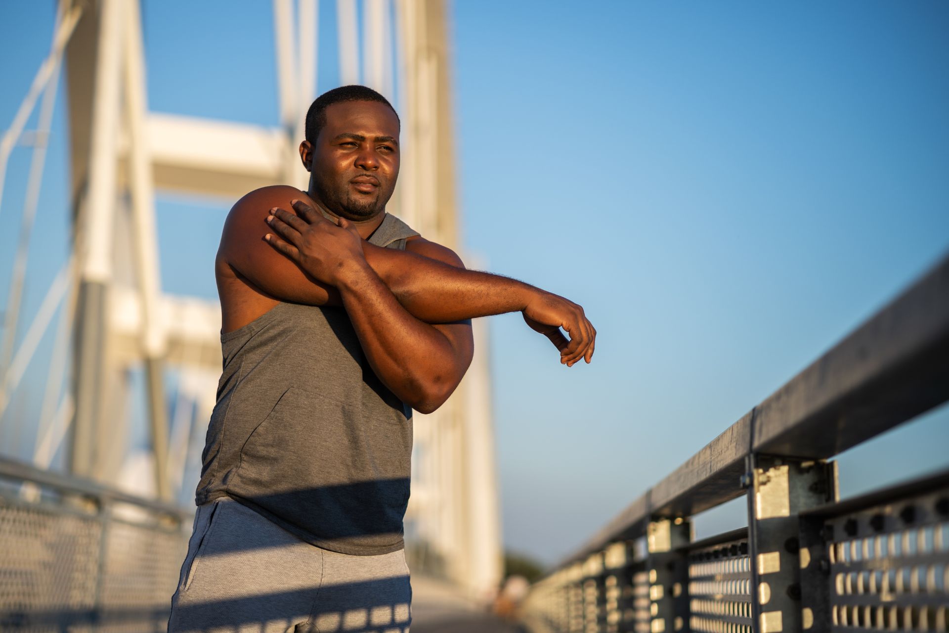 exercising image a man exercising on a bridge